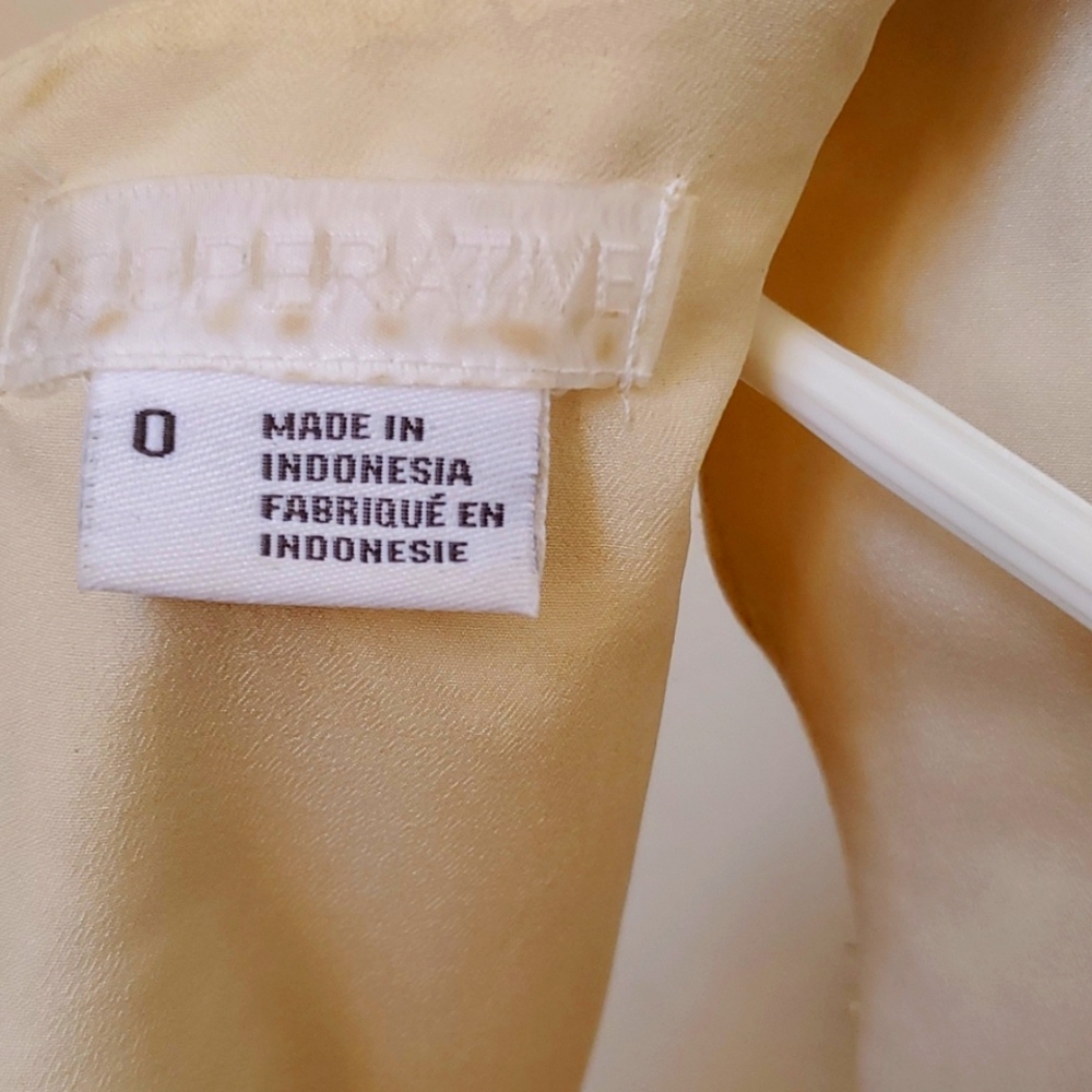 A cream dress with gold flower design